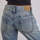 Low Rise Twisted Seam Ripped Jean in True Blue